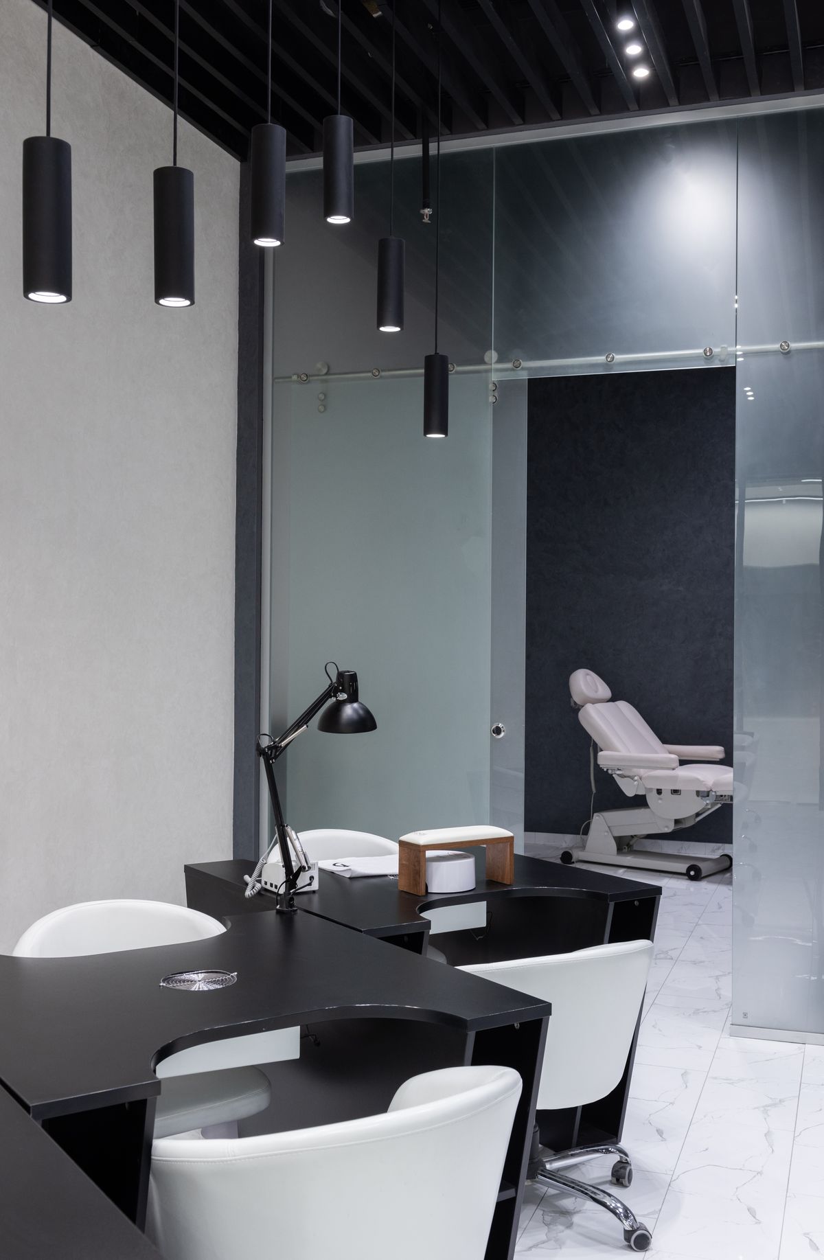 Interior of Nisha Beauty Salon showing styling stations and premium hair care products
