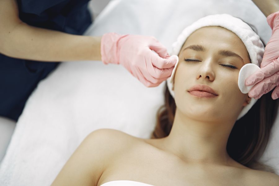 Woman receiving a relaxing facial treatment